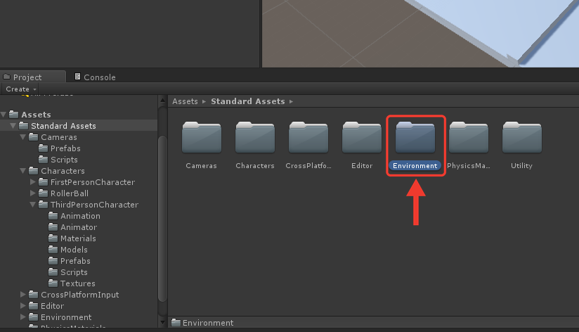 Painel Project com o conteúdo da pasta Standard Assets: as pastas Cameras, Characters, CrossPlatformInput, Editor, Environment, PhysicsMaterials e Utility. Uma seta e uma moldura vermelha destacam a pasta Environment