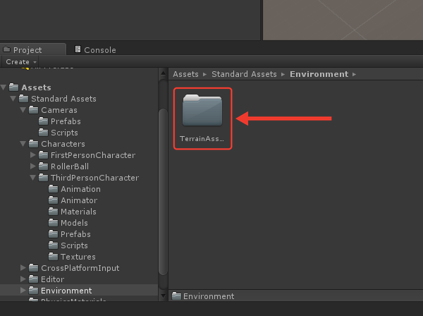 Painel Project com o conteúdo da pasta Environment: apenas a pasta TerrainAssets, destacada por uma seta e uma moldura vermelha